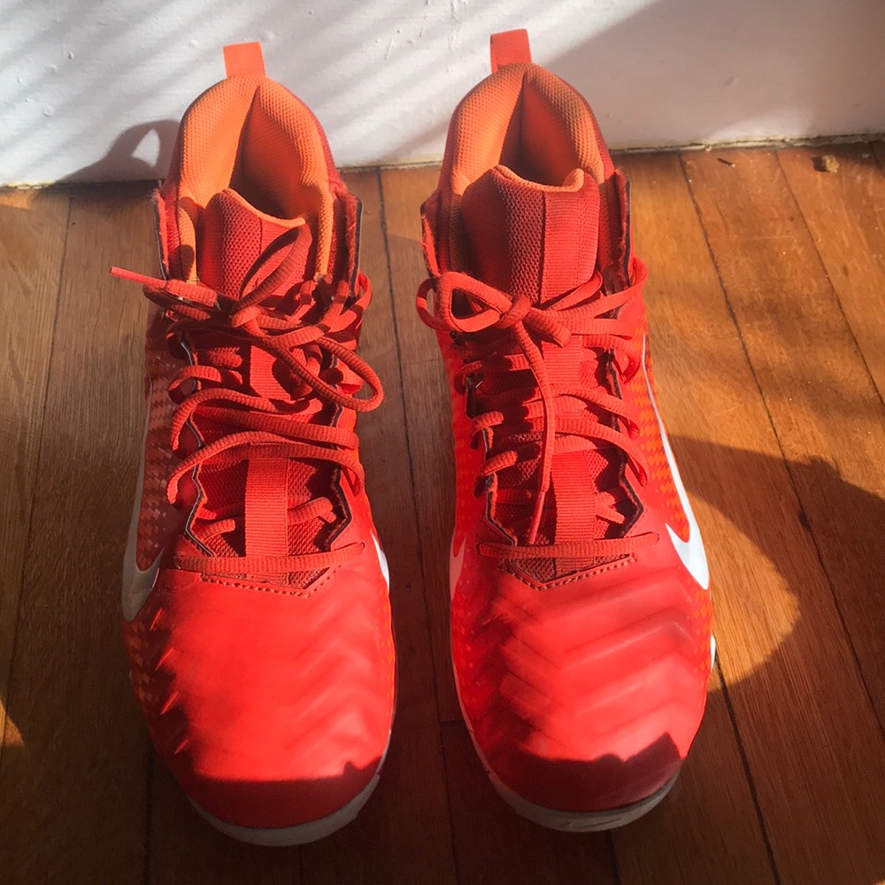 Orange NIKE football cleats